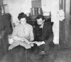 Lena & Herman Seibel reading at home